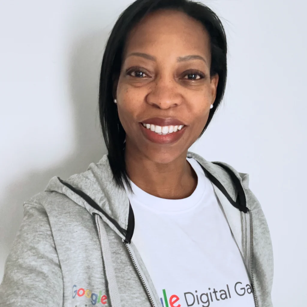 Portrait headshot of Beverly Clarke MBE smiling while wearing a Google Digital Garage hoodie.